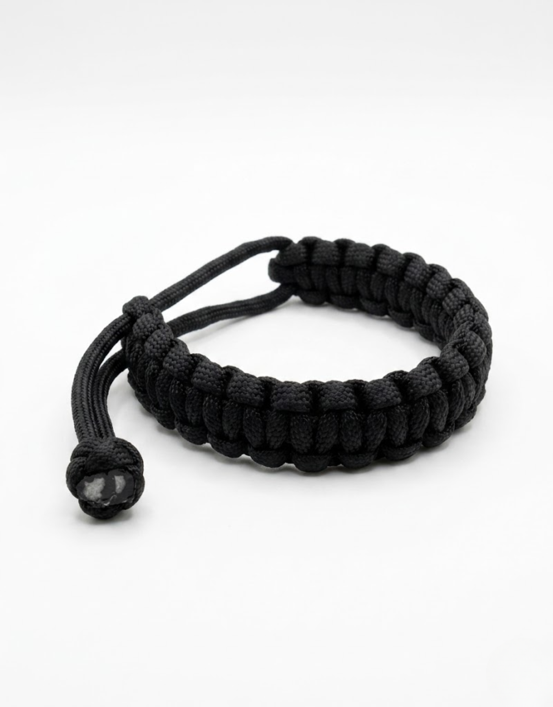 Black handmade paracord bracelet with an adjustable sliding knot