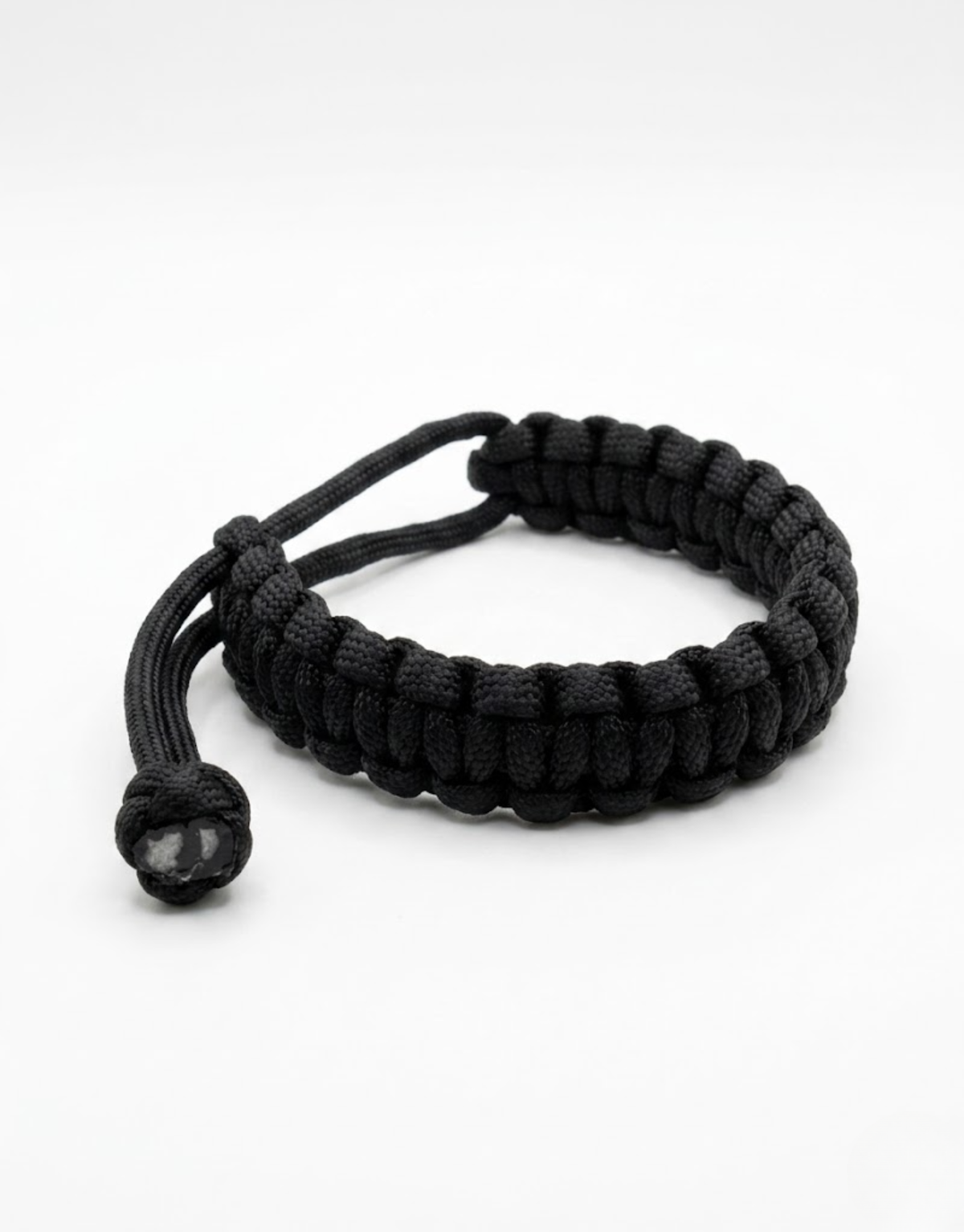Black handmade paracord bracelet with an adjustable sliding knot
