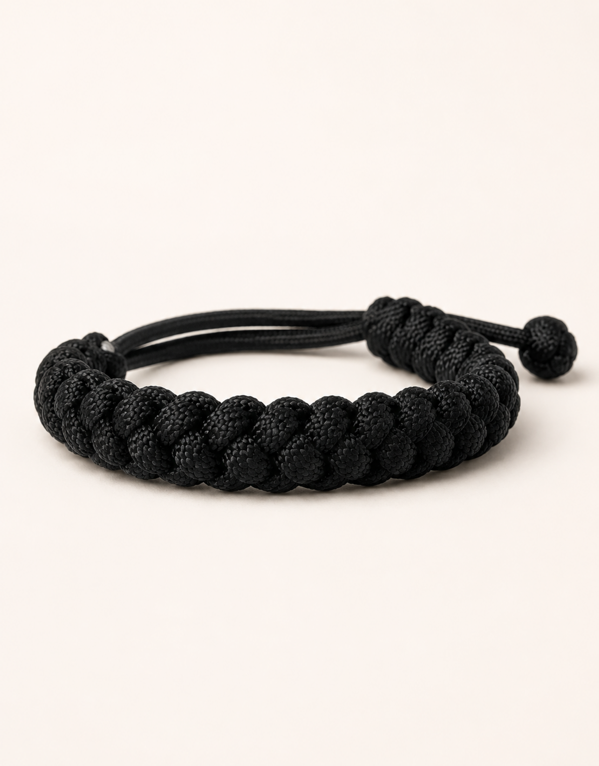 Black handmade paracord bracelet by Giraa, a birthday gift idea for a male best friend in Pakistan