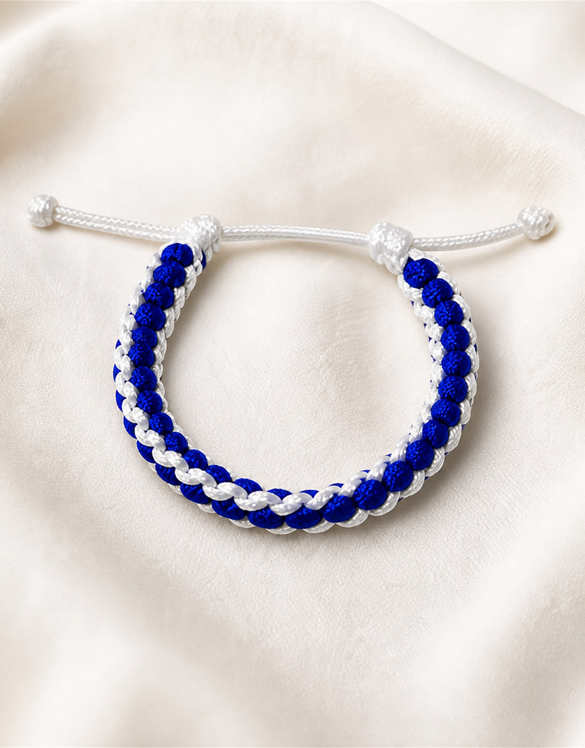 Samawi blue and white macrame bracelet on linen