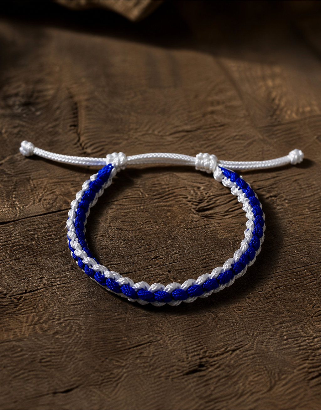 Samawi blue and white macrame bracelet on dark wood