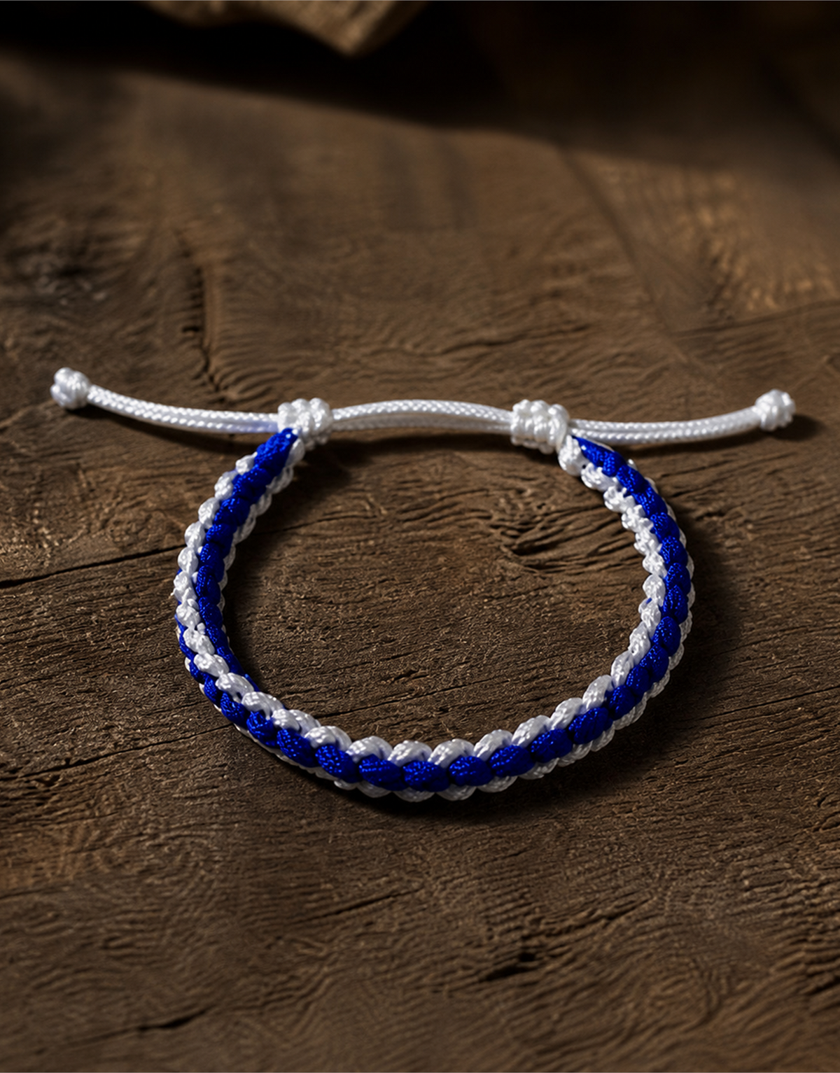 Samawi blue and white macrame bracelet on dark wood