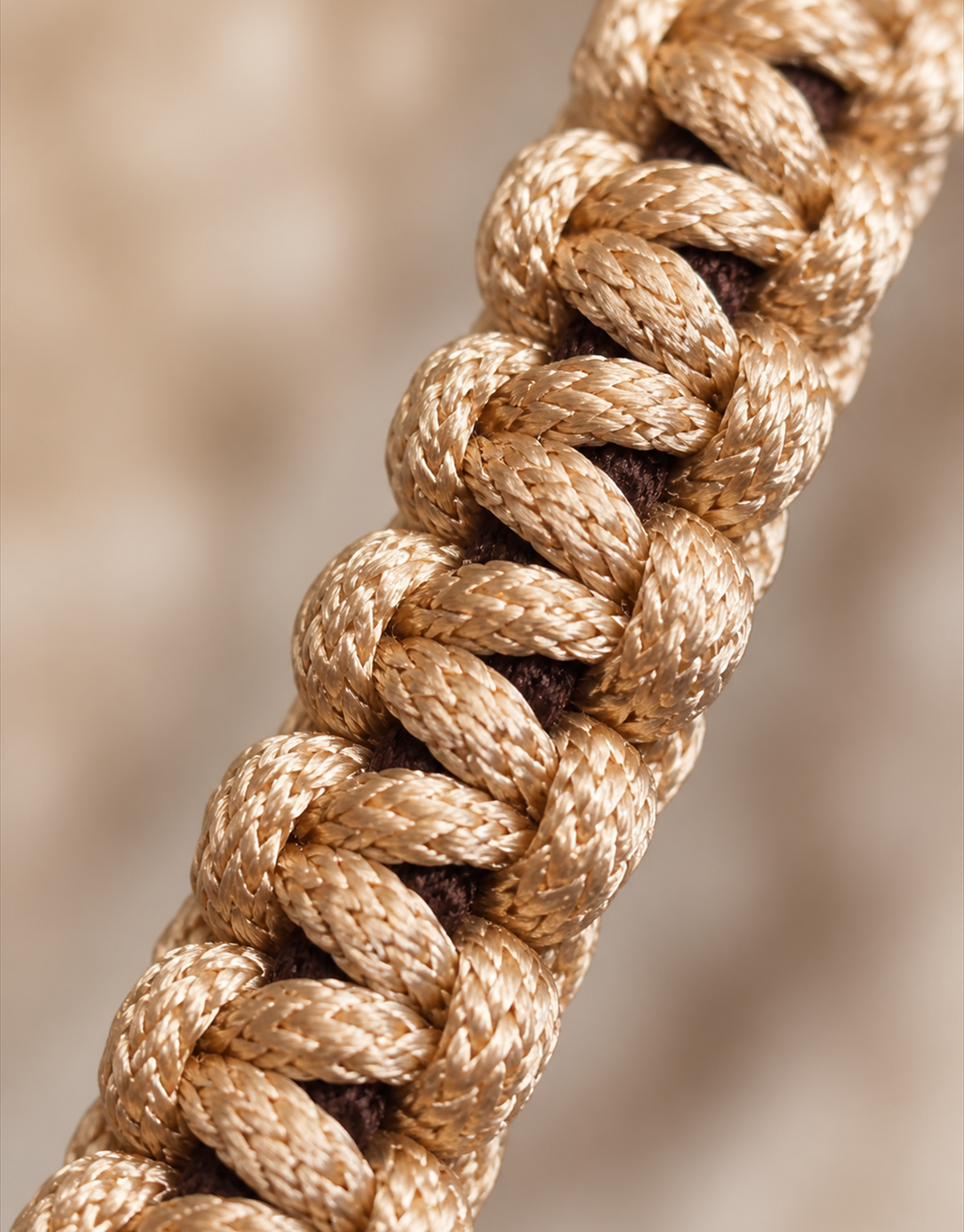 Macro of the tan and brown weave on the Qamhi macrame bracelet