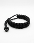 Aswad black paracord bracelet for men, handmade 550 cord cobra weave by Giraa, Pakistan