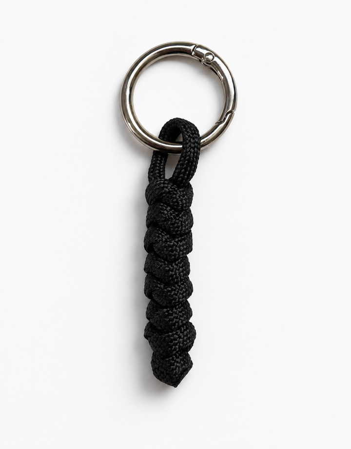 Lahar black spiral paracord keychain with steel ring, handmade by Giraa, Pakistan