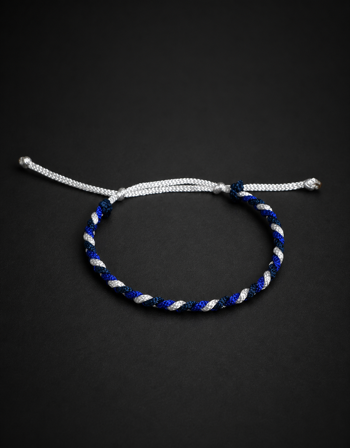Sadeem blue, white and black bracelet on a black background