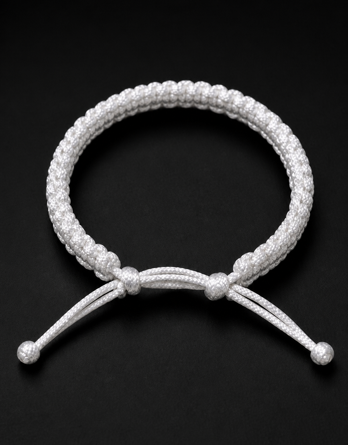 Durr white macrame bracelet on a black background