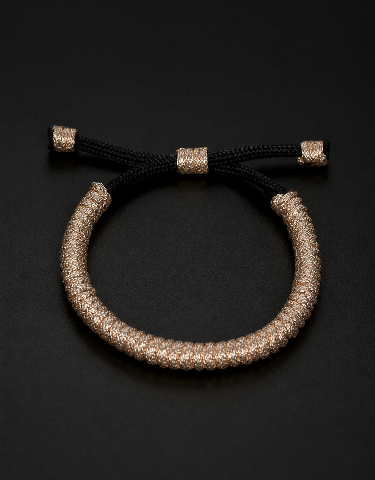 Kathib tan spiral bracelet on a black background
