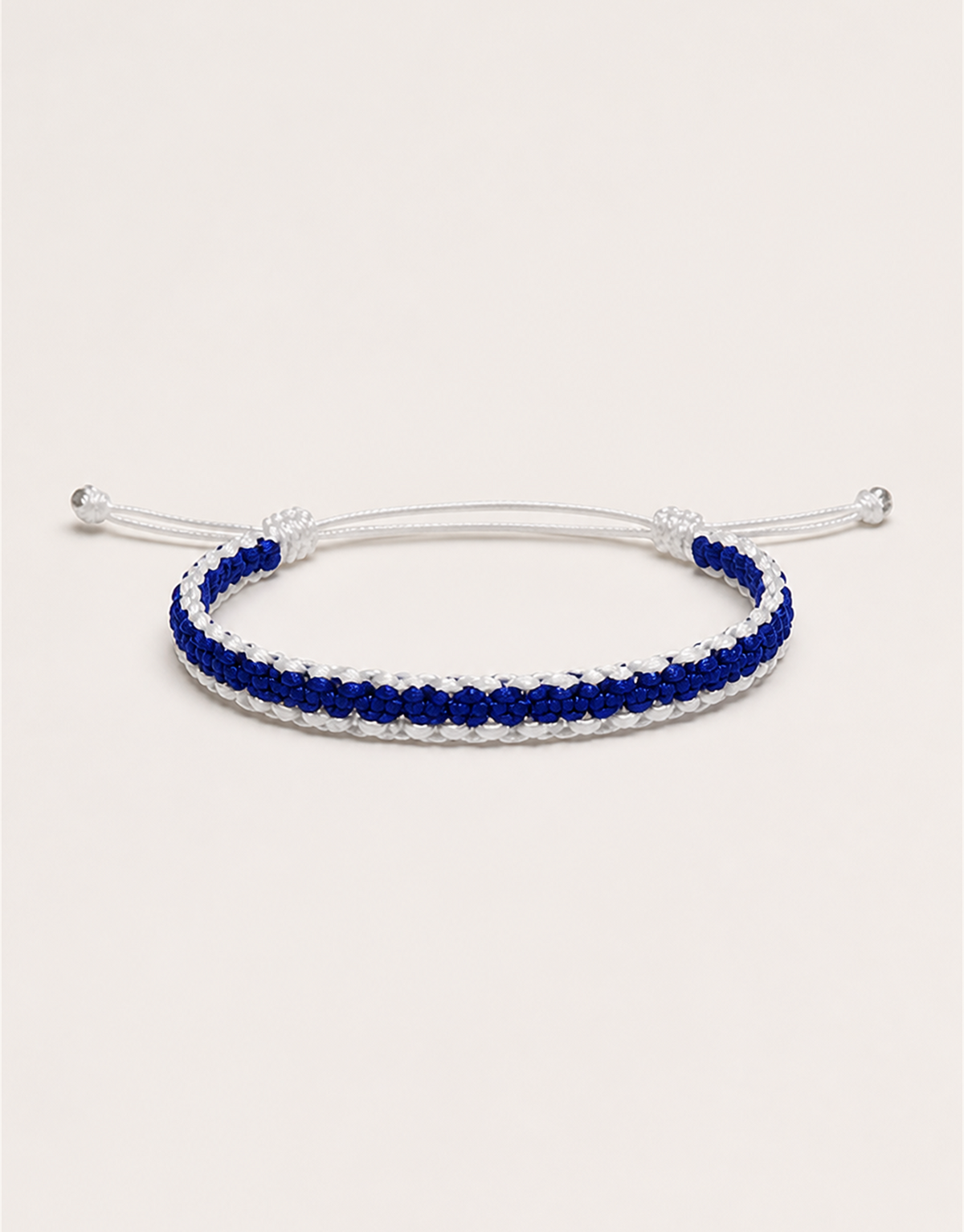 Samawi blue and white cord bracelet laid flat