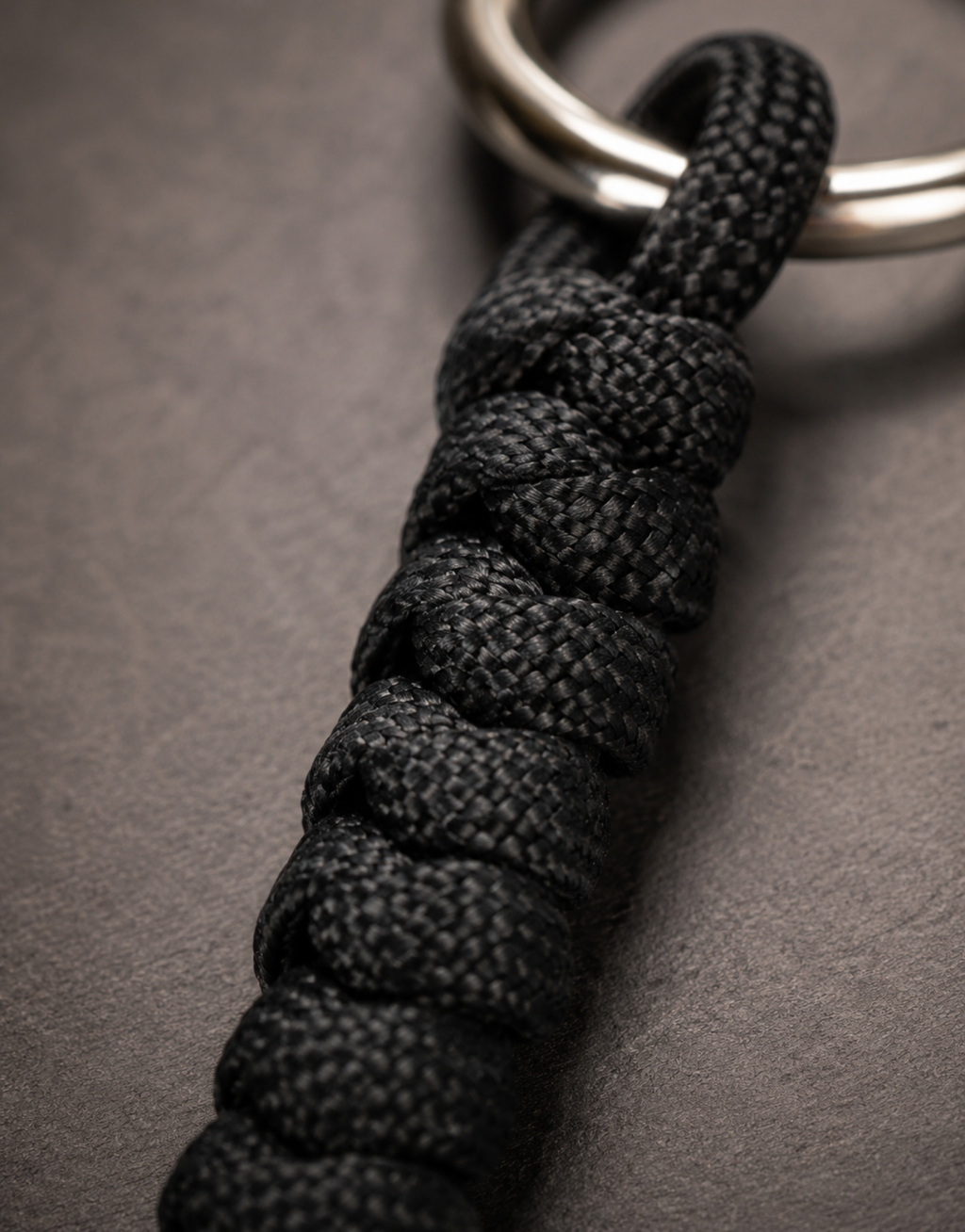 Close-up of the black spiral weave on the Lahar paracord keychain