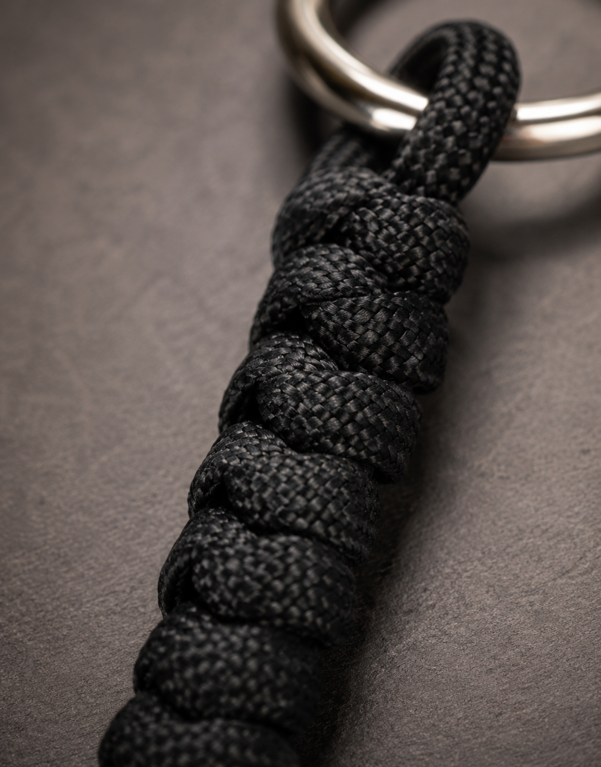 Close-up of the black spiral weave on the Lahar paracord keychain