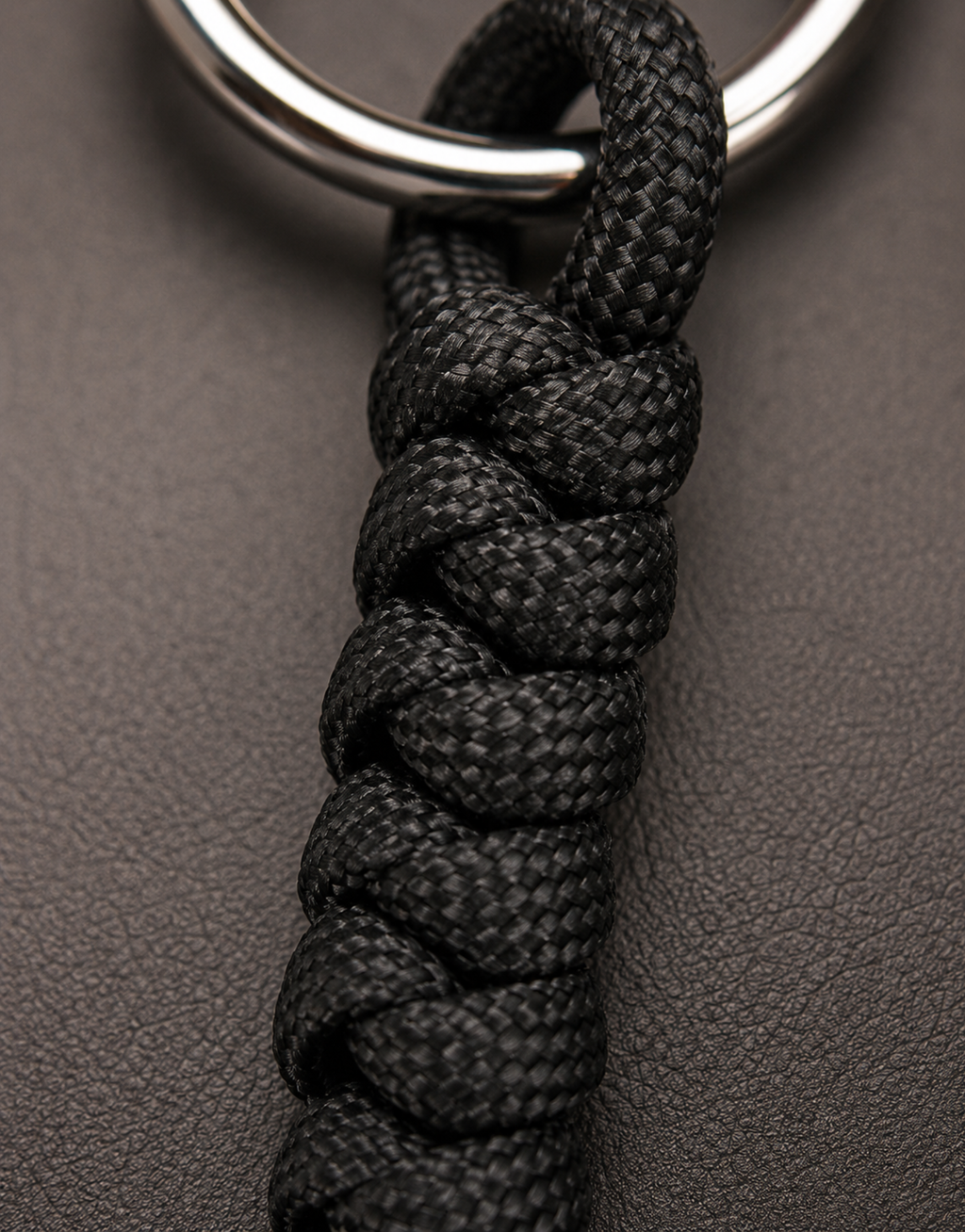 Black spiral weave and steel ring on the Lahar paracord keychain