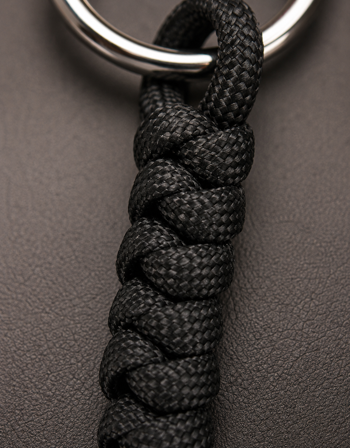 Black spiral weave and steel ring on the Lahar paracord keychain