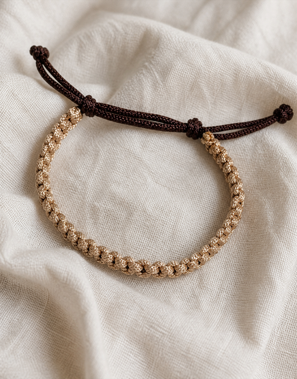 Qamhi tan and brown macrame bracelet on linen