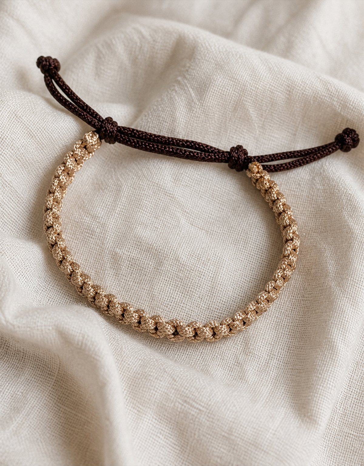 Qamhi tan and brown macrame bracelet on linen