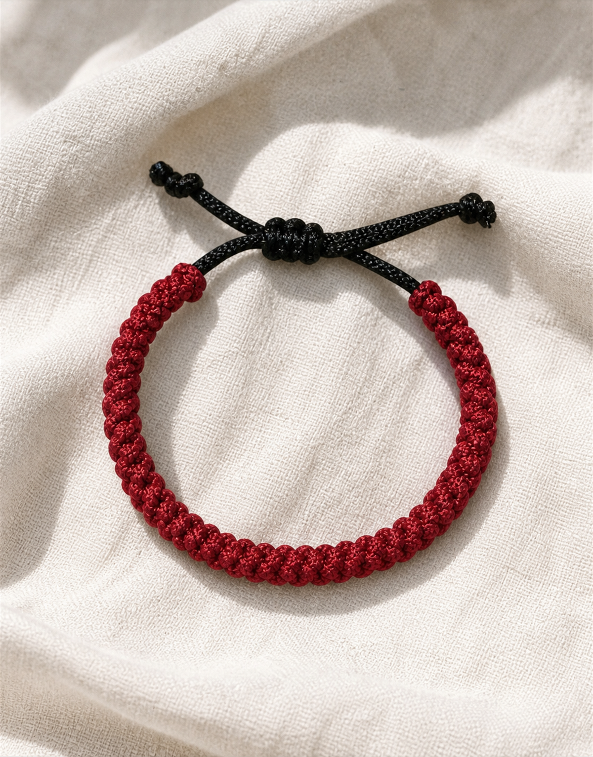 Jamr red and black macrame bracelet on linen