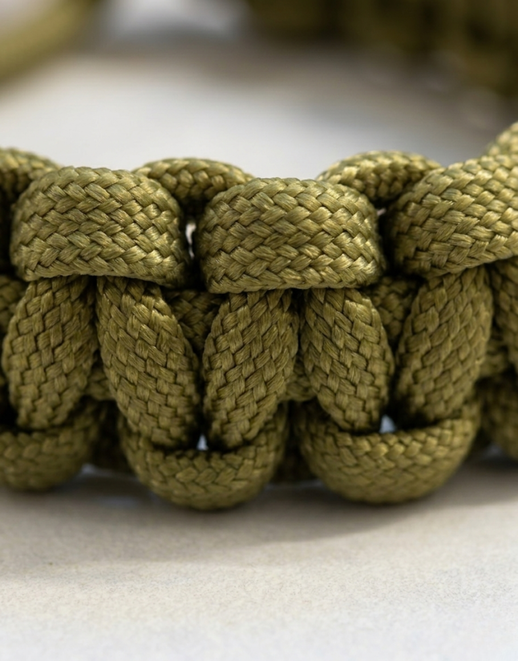 Close-up of the olive cobra weave on the Zeytoon handmade paracord bracelet