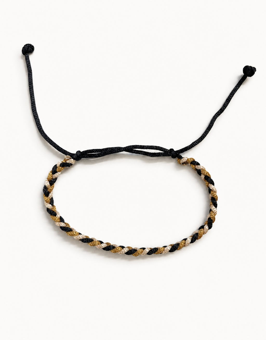 Zari black, gold and cream macrame bracelet, handmade by Giraa in Pakistan