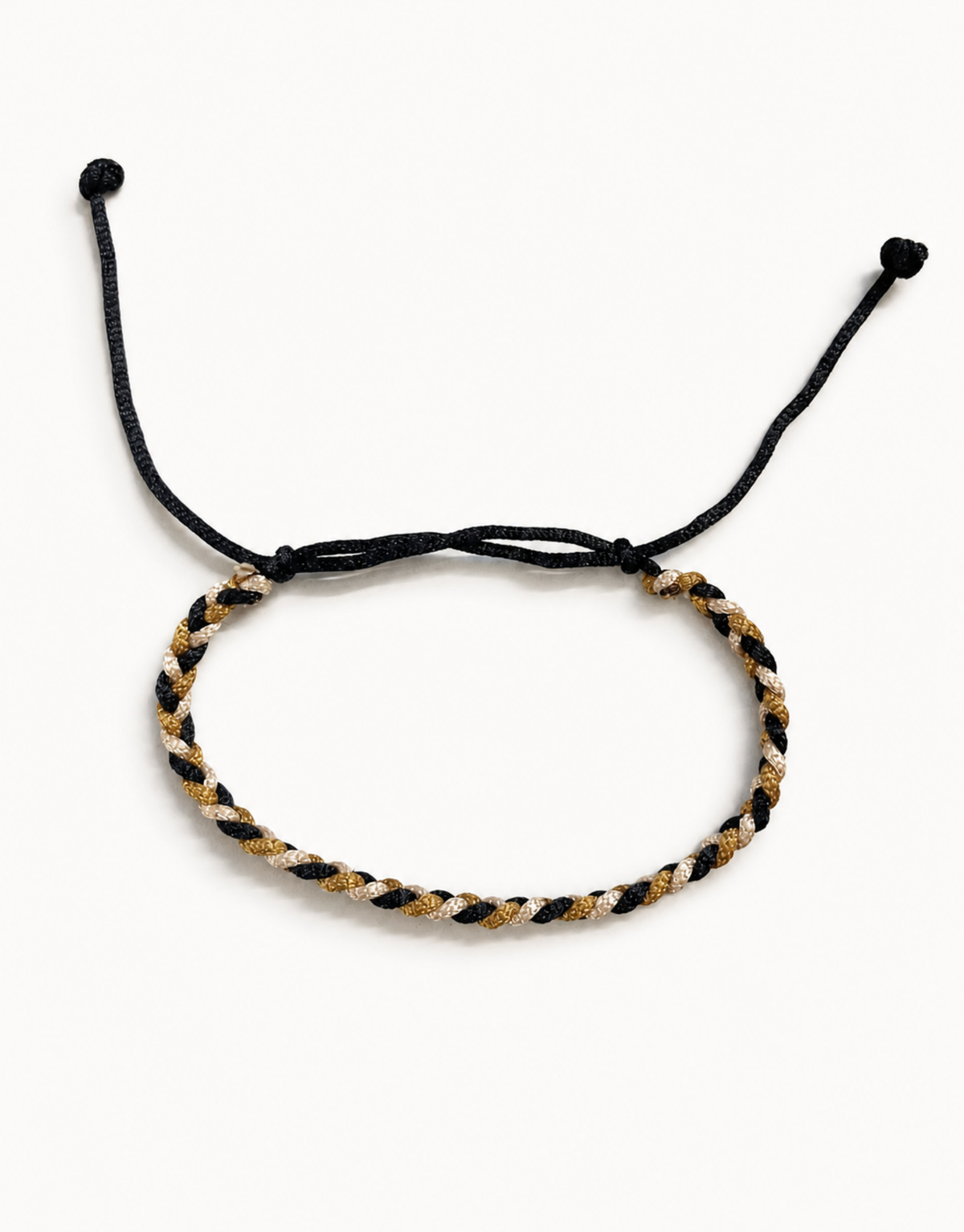 Zari black, gold and cream macrame bracelet, handmade by Giraa in Pakistan