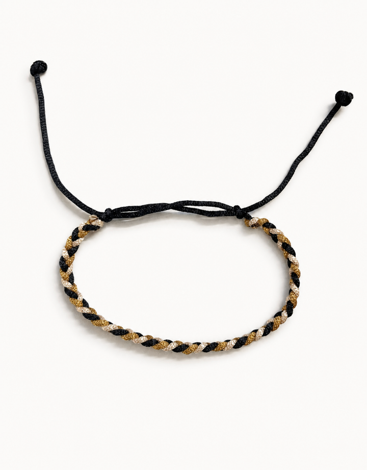 Zari black, gold and cream macrame bracelet, handmade by Giraa in Pakistan