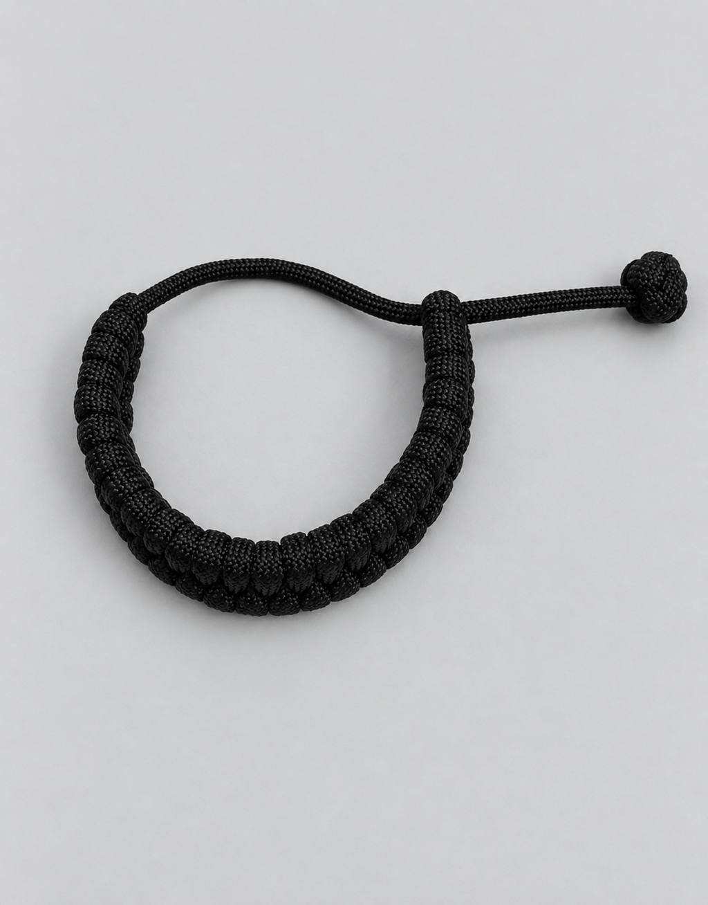 Juft black paracord bracelet flat lay