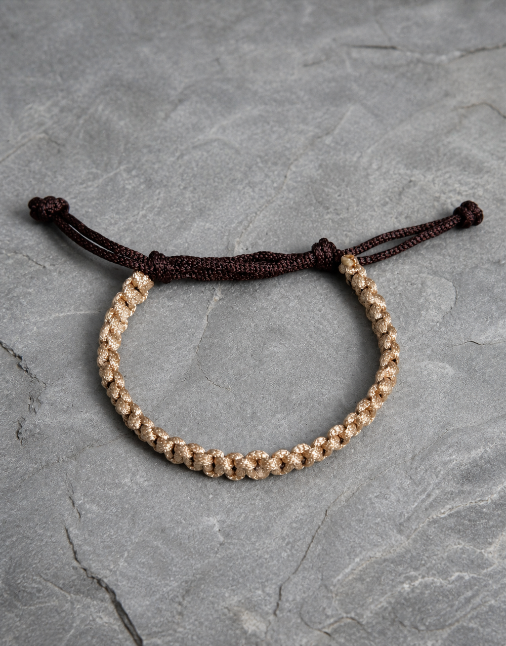 Qamhi tan macrame bracelet on grey slate