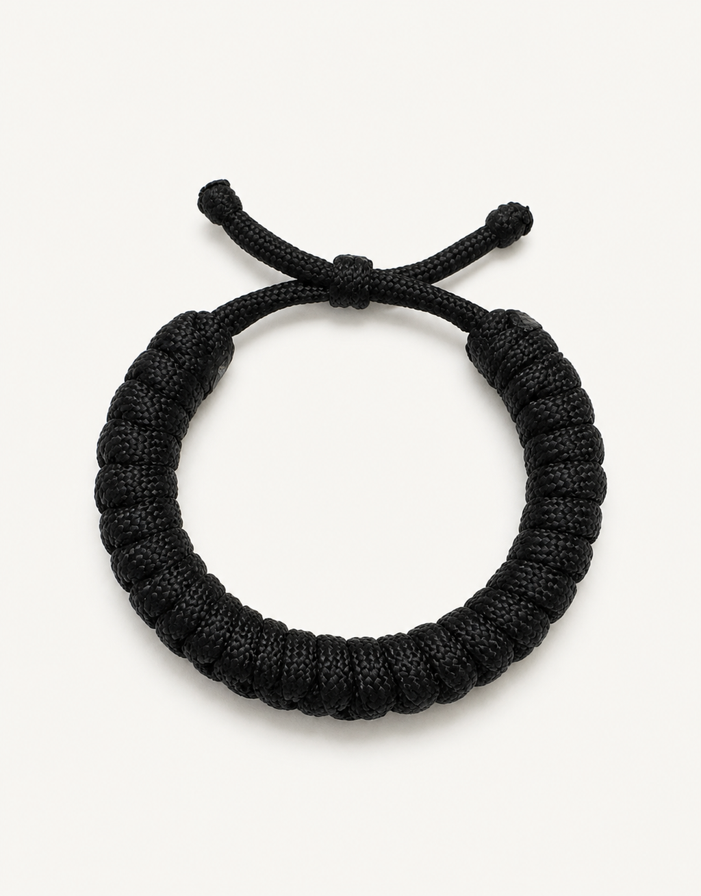 Su'ban black spiral paracord bracelet for men, handmade by Giraa in Pakistan