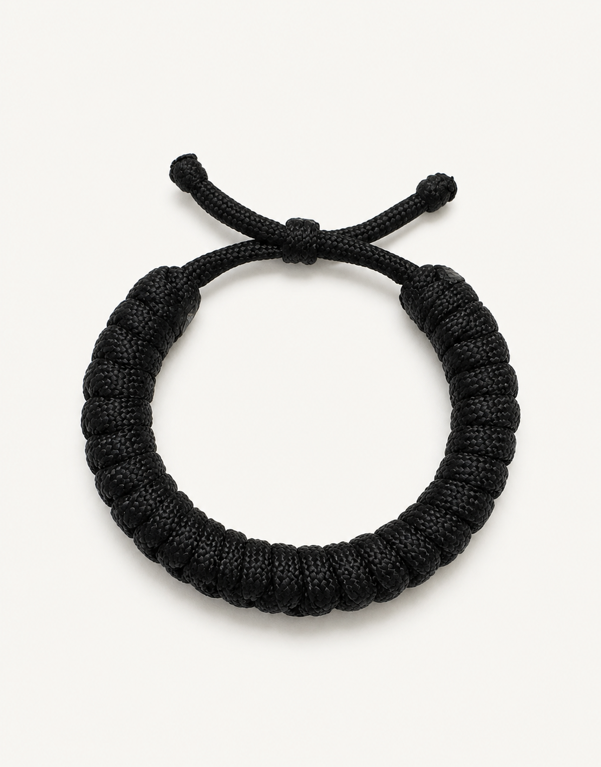 Su'ban black spiral paracord bracelet for men, handmade by Giraa in Pakistan