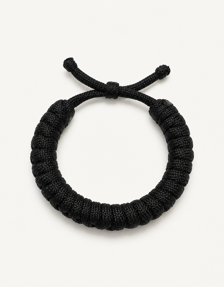 Su'ban black spiral paracord bracelet for men, handmade by Giraa in Pakistan