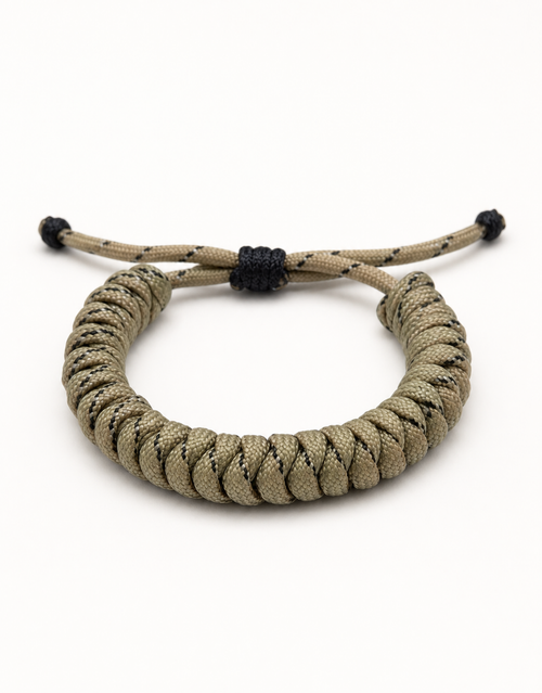 Ramad sand and black speckled spiral paracord bracelet for men, handmade by Giraa in Pakistan