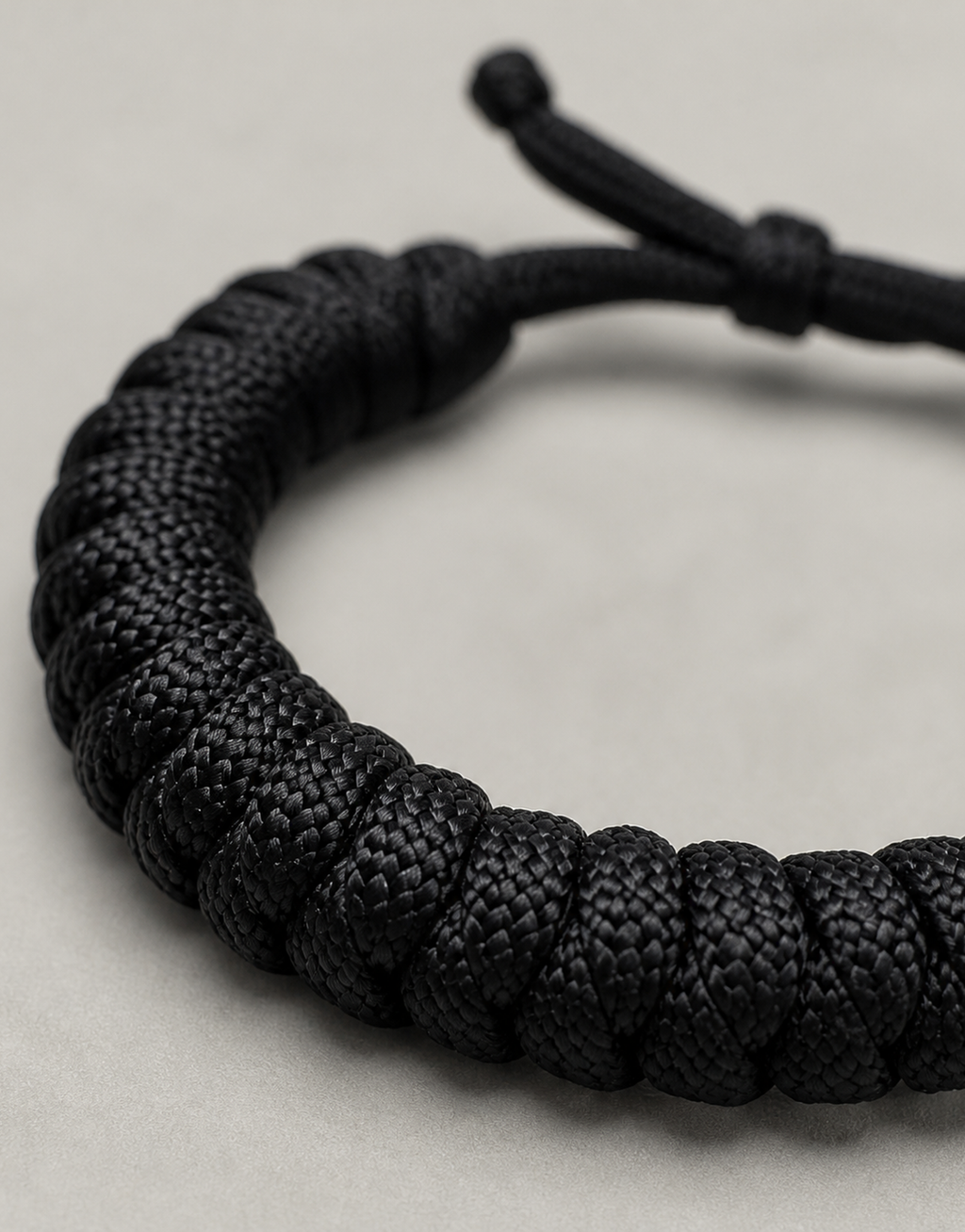 Close-up of the black spiral weave on the Su'ban paracord bracelet