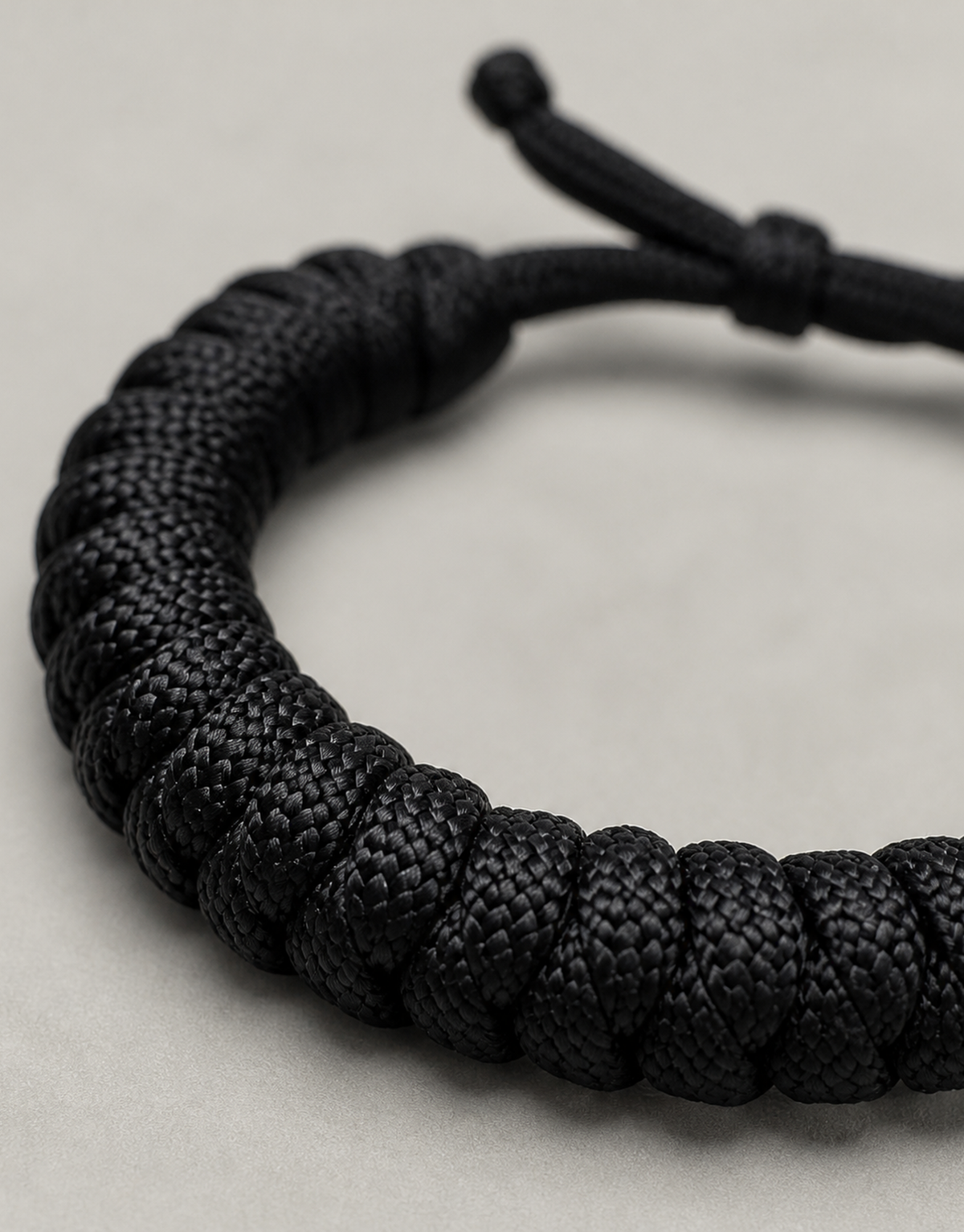 Close-up of the black spiral weave on the Su'ban paracord bracelet