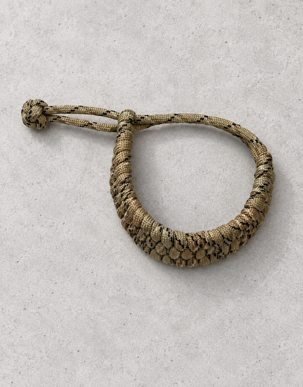 Chhalawa camo paracord bracelet on concrete
