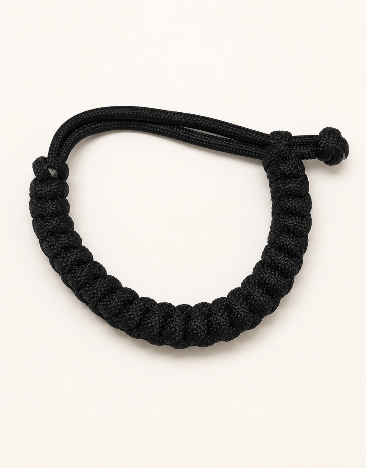 Pech black paracord bracelet showing the adjustable sliding closure