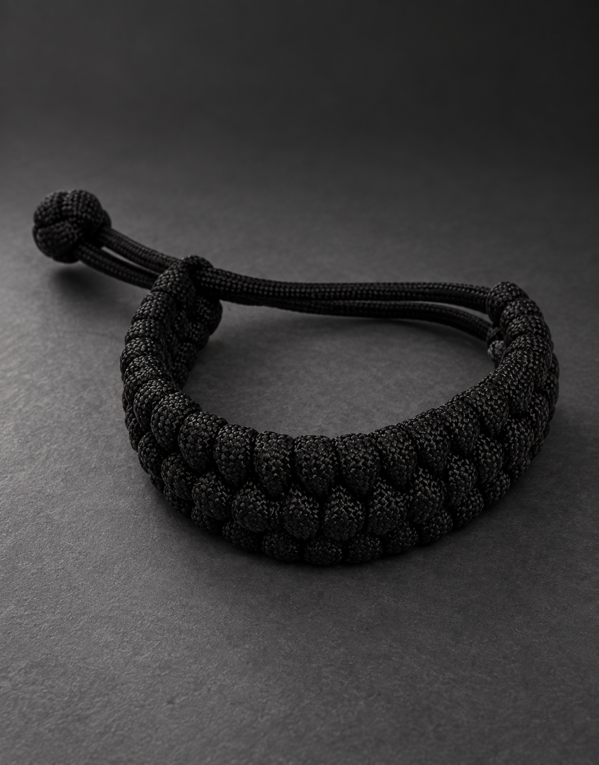 Musallas black paracord bracelet dark studio
