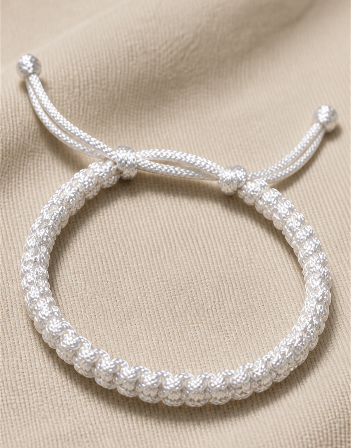 Durr white macrame bracelet on linen