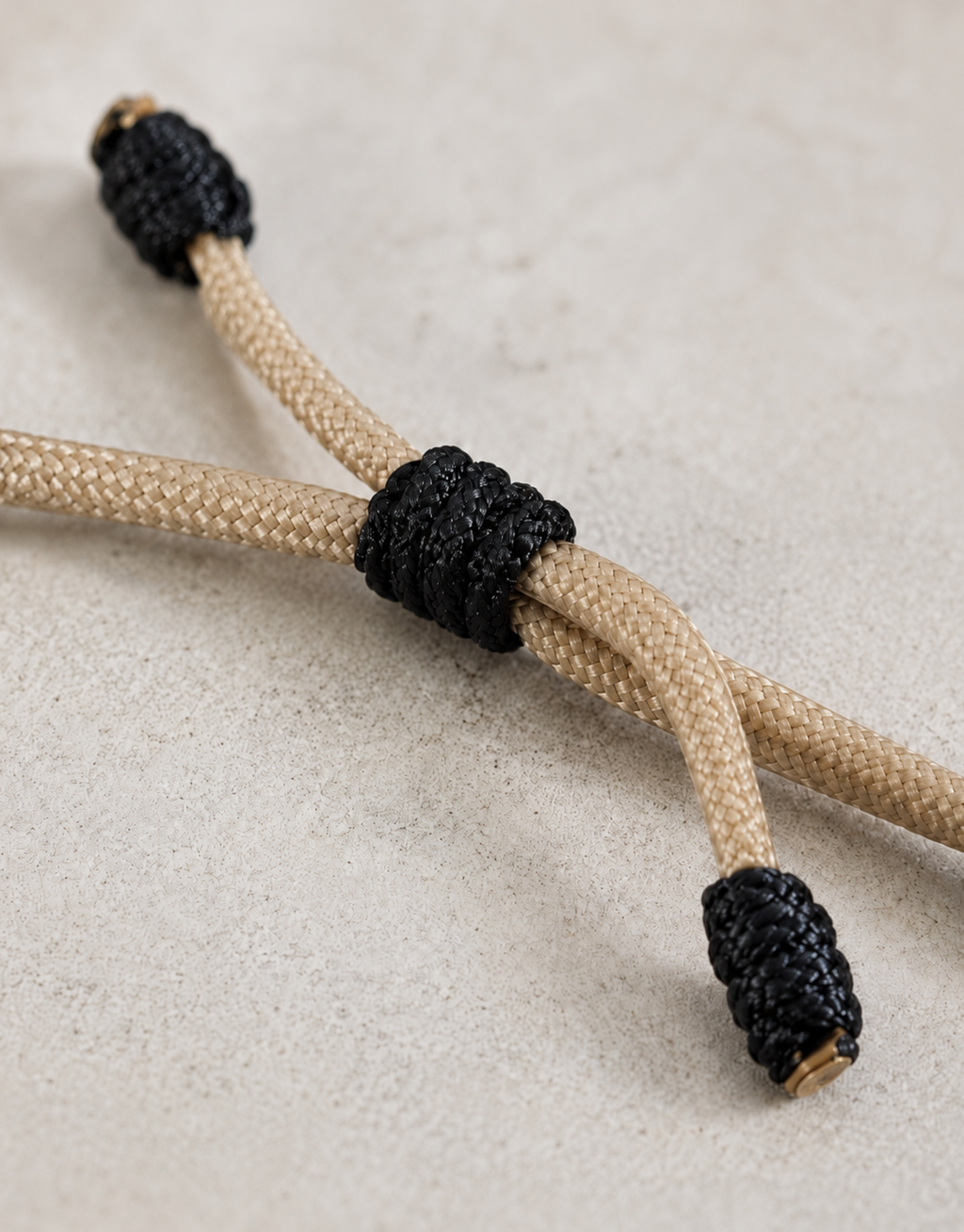 Adjustable sliding knot with black end knots on the Raml paracord bracelet