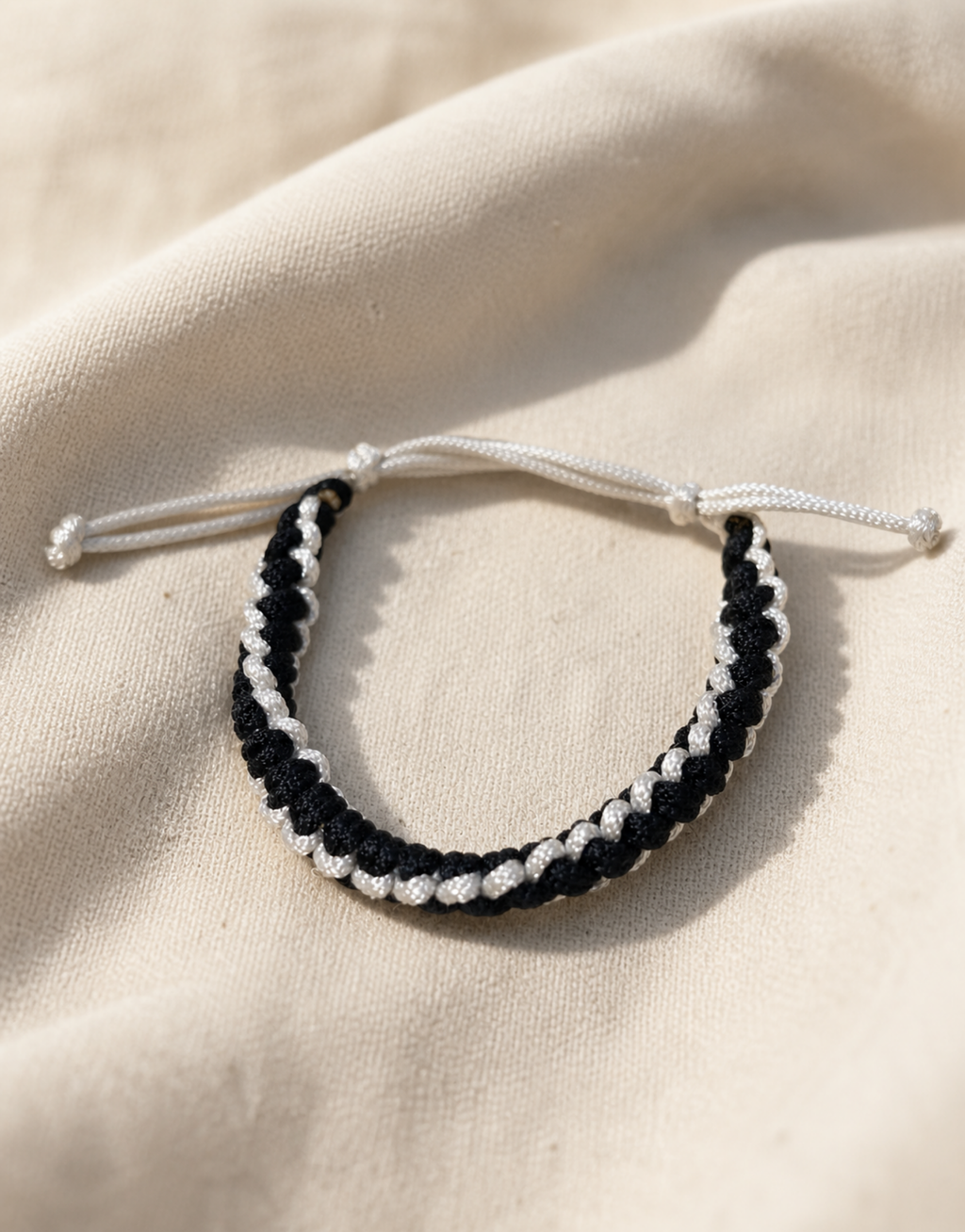 Shatranj macrame bracelet on cream linen