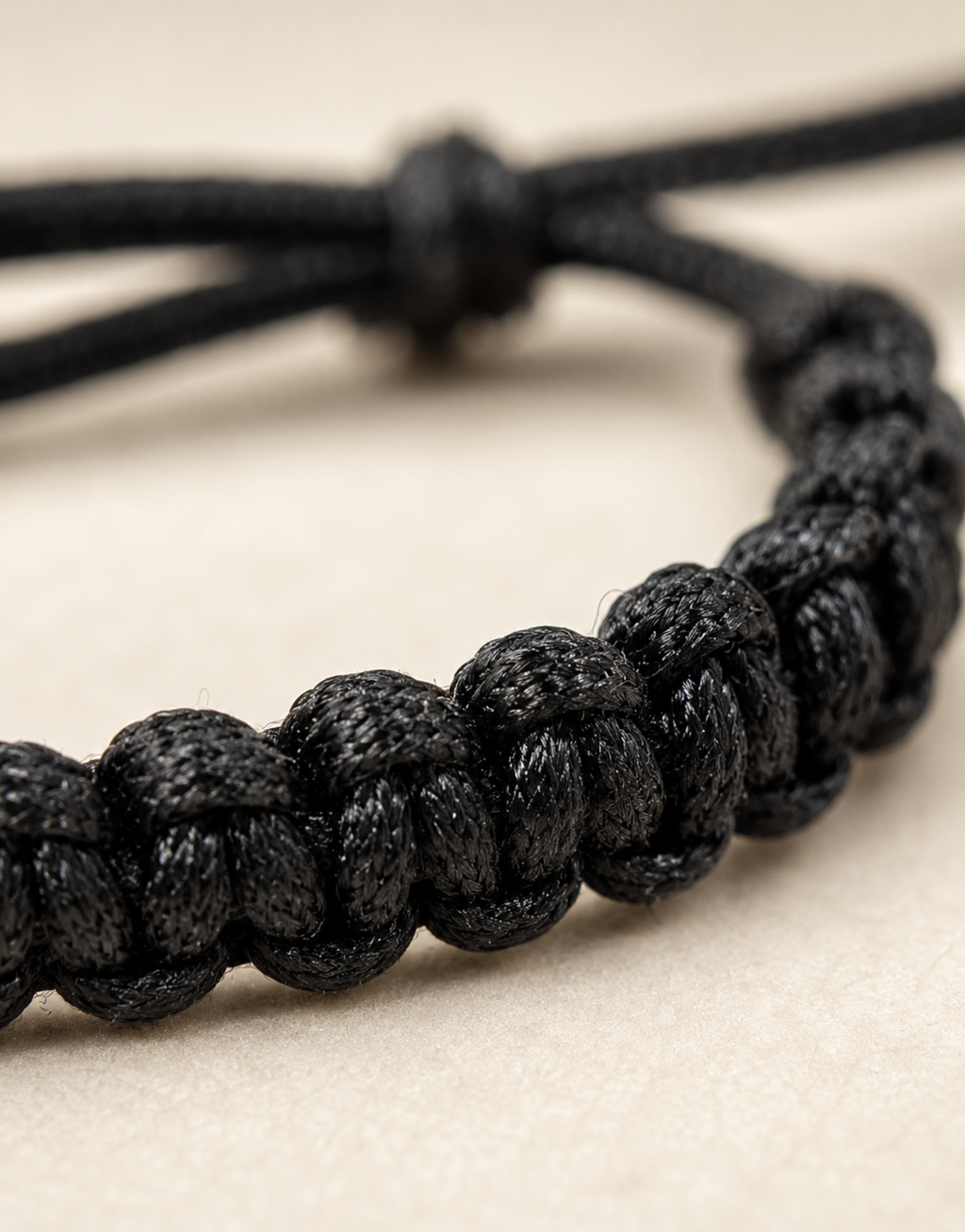 Close-up of the black macrame weave on the Khayt bracelet