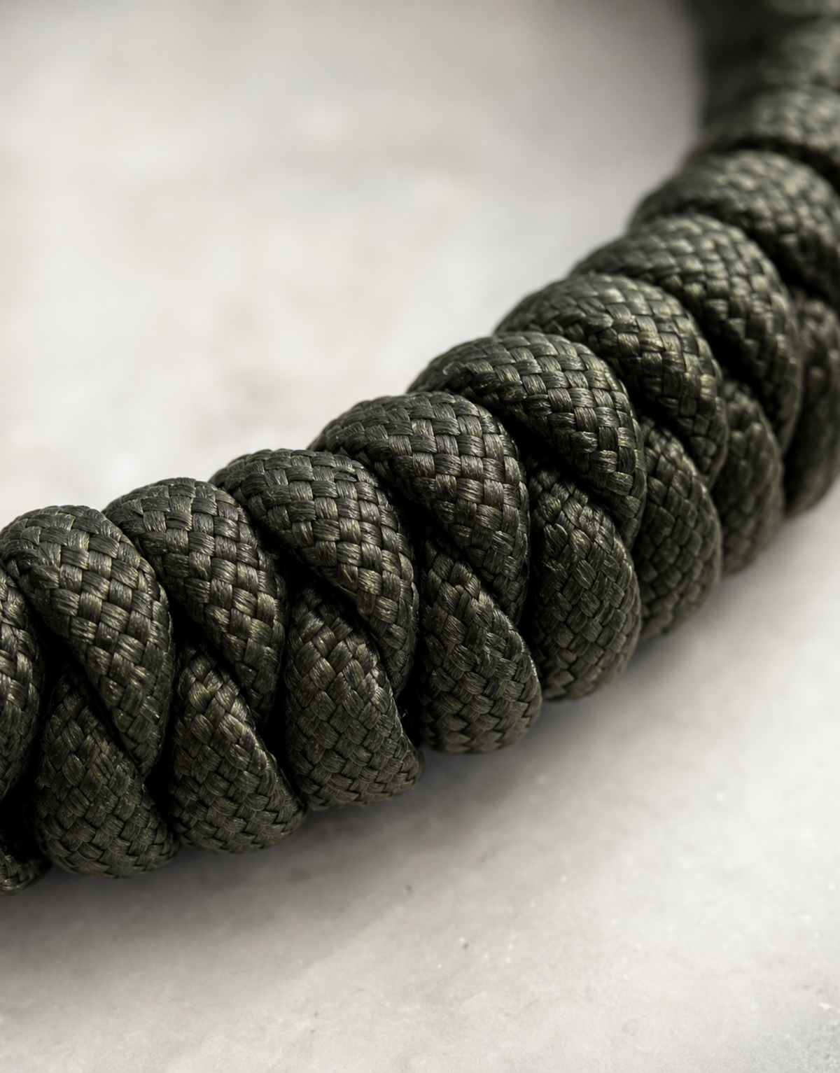 Close-up of the forest green spiral weave on the Ghaba paracord bracelet