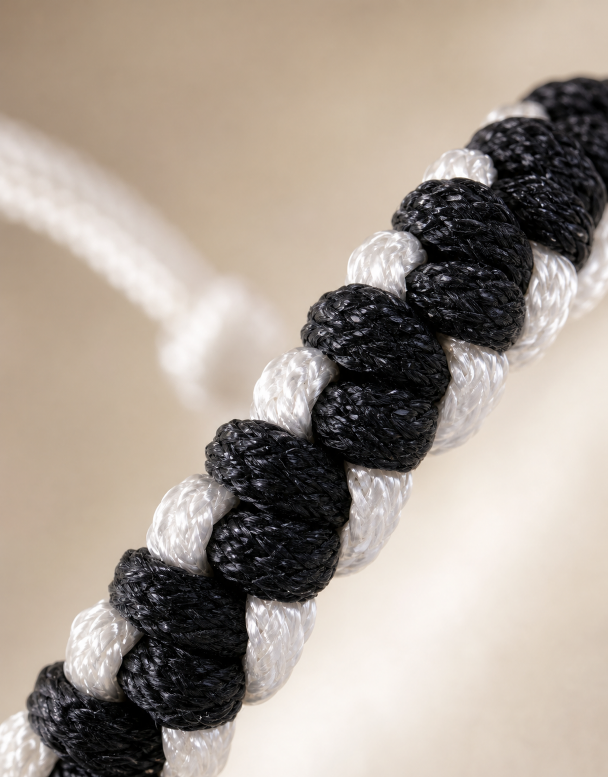 Macro of the black and white weave on the Shatranj macrame bracelet