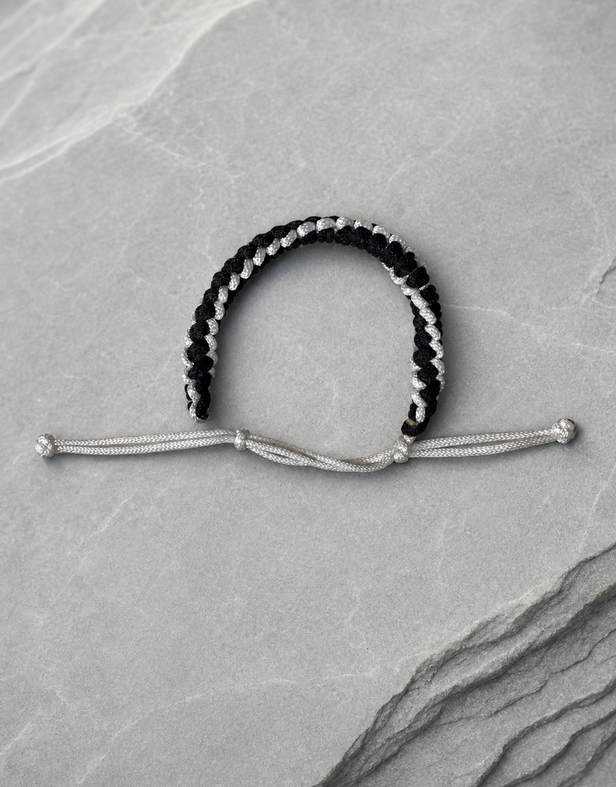 Shatranj macrame bracelet on grey stone