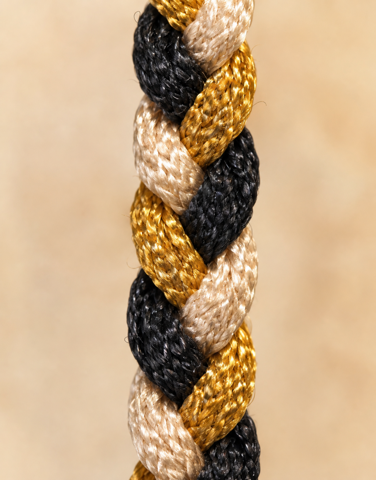 Macro of the black, gold and cream braid on the Zari macrame bracelet