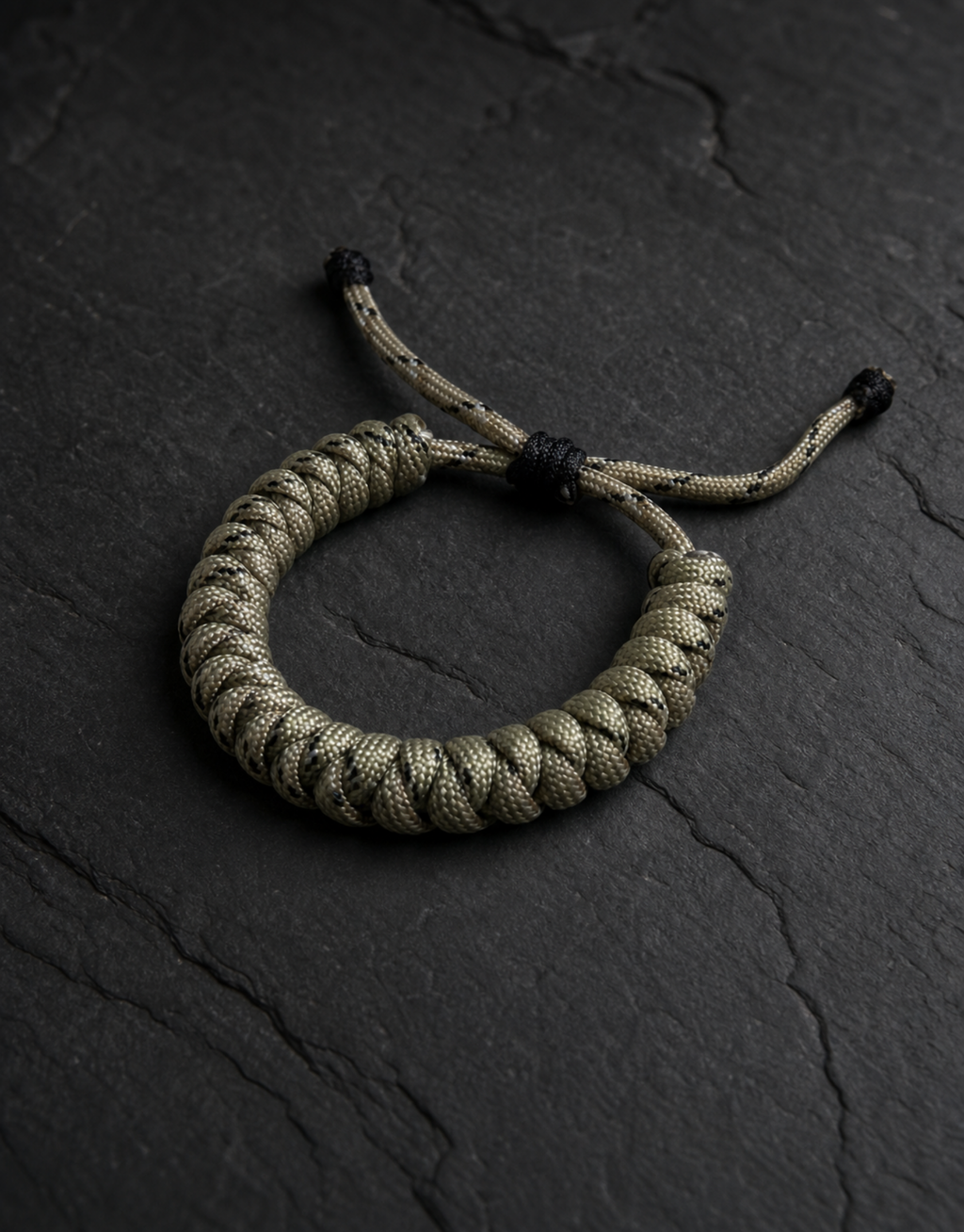 Ramad speckled spiral paracord bracelet on dark slate