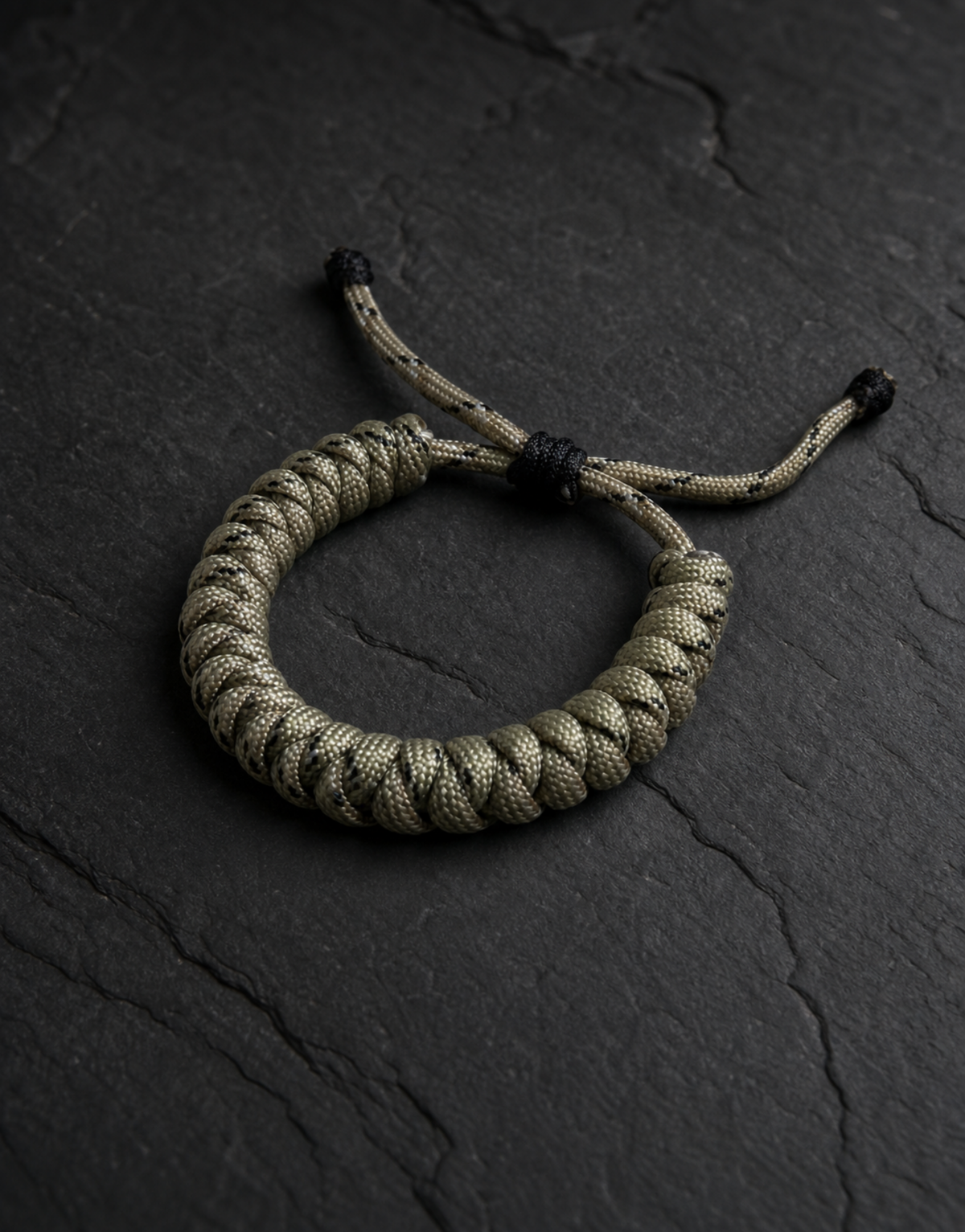 Ramad speckled spiral paracord bracelet on dark slate