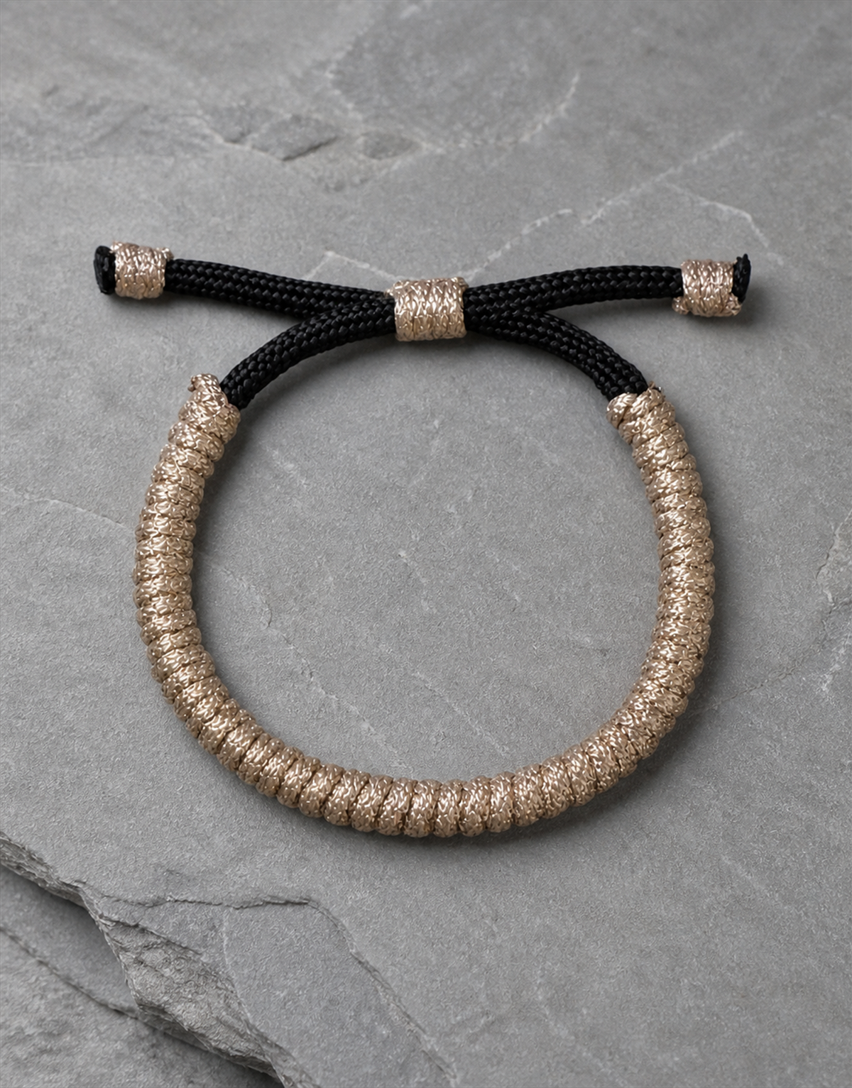 Kathib tan spiral macrame bracelet on grey slate