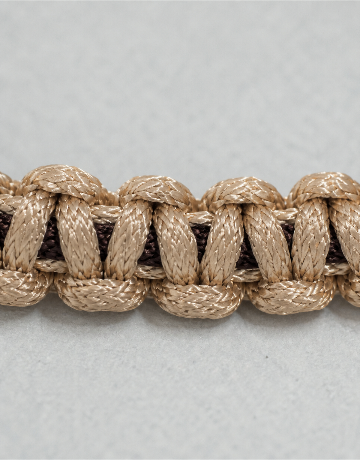 Side close-up of the Qamhi tan macrame weave