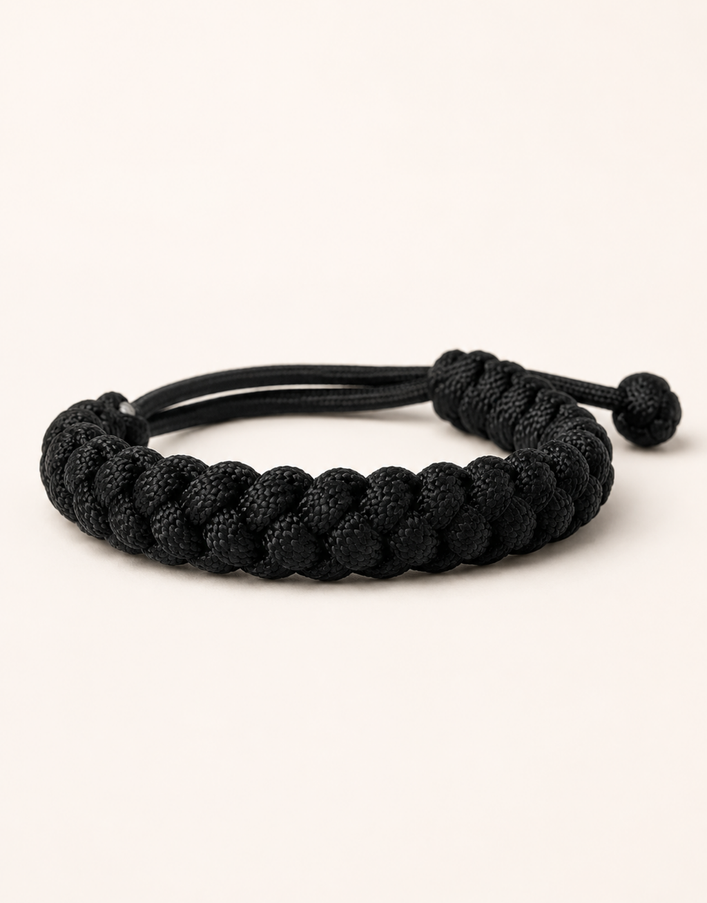 Pech black spiral paracord bracelet for men, handmade by Giraa in Pakistan