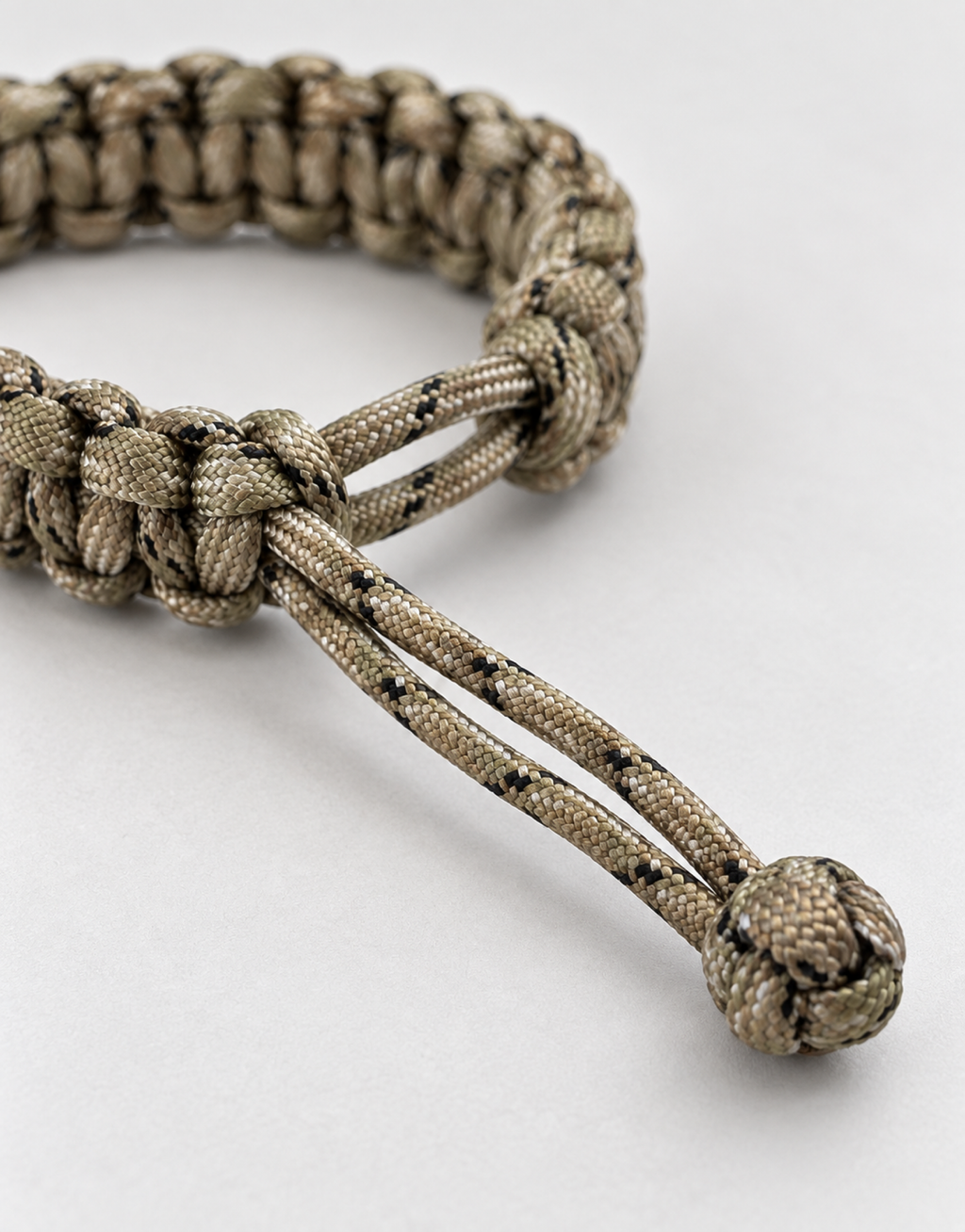Loop and knot closure on the Ghubar camo paracord bracelet