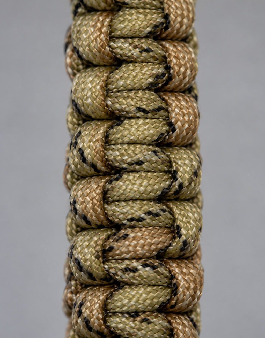 Close-up of the camo cobra weave on the Naag paracord keychain